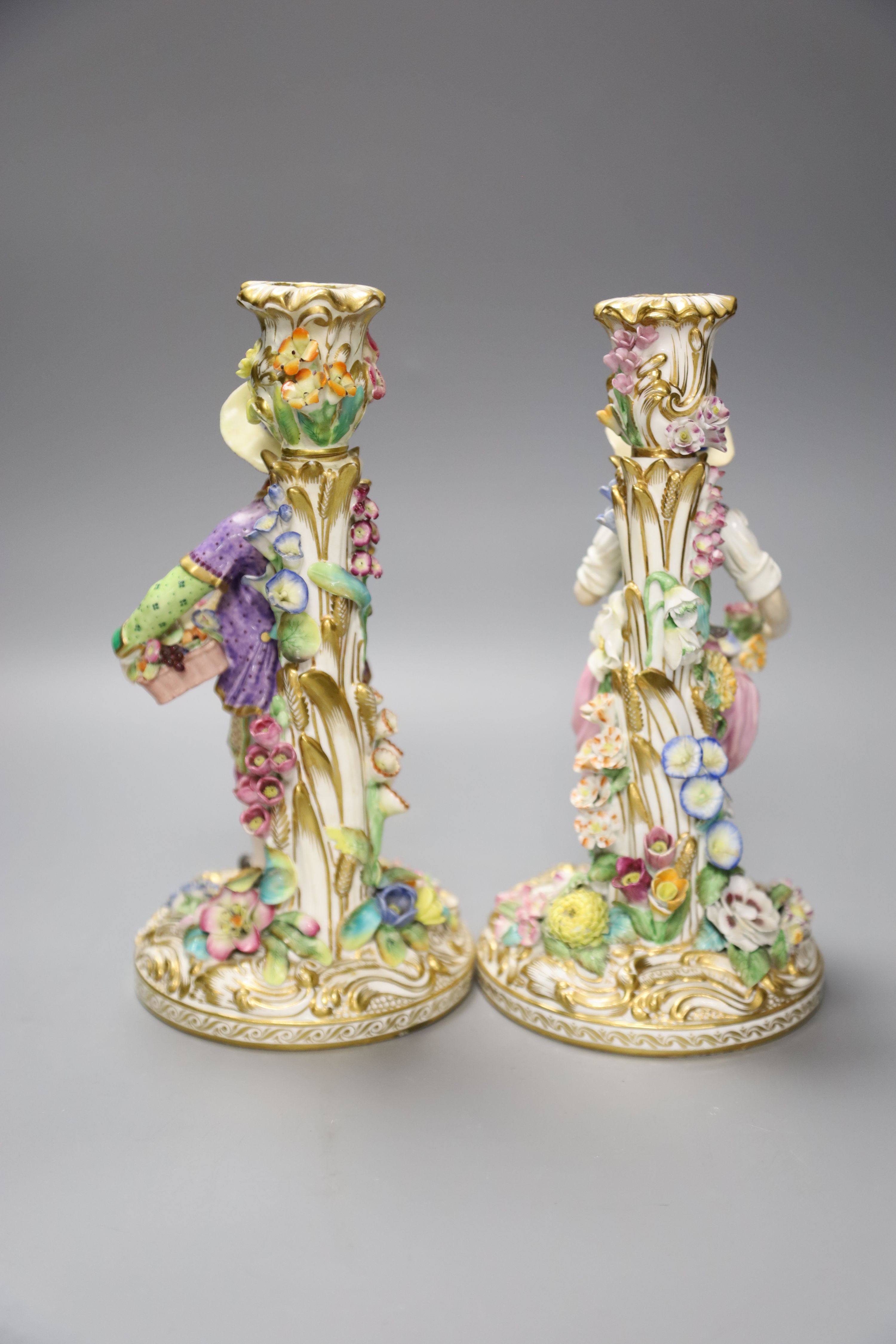 A pair of 19th century Minton figural candlesticks of a boy and girl, height 23cm